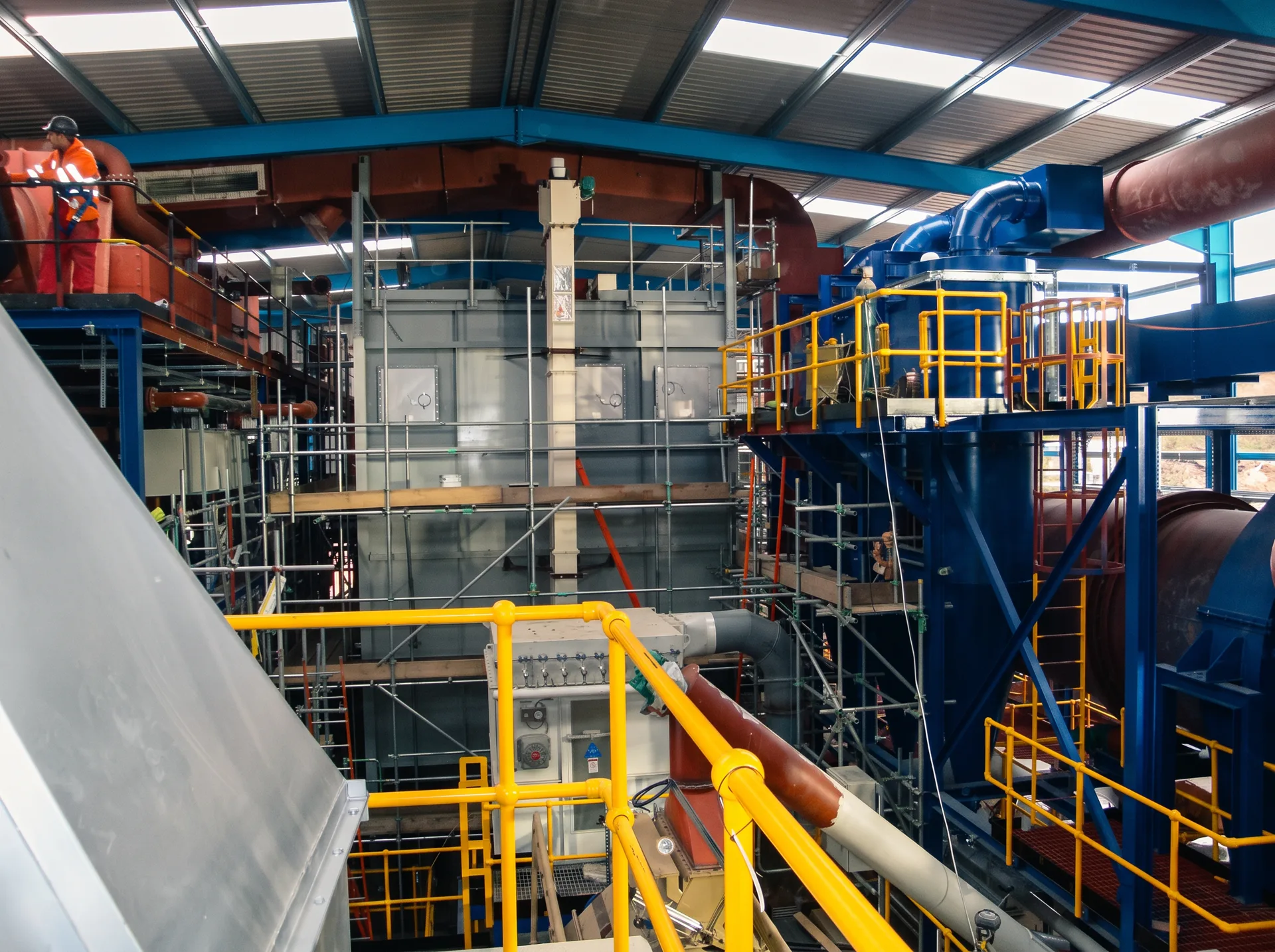 Feed preparation, drying and material-handling equipment inside an industrial plant